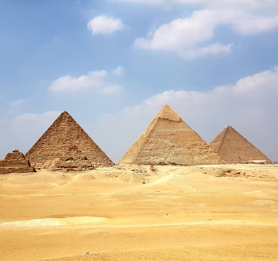 brown pyramid under blue sky during daytime