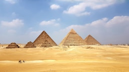 brown pyramid under blue sky during daytime