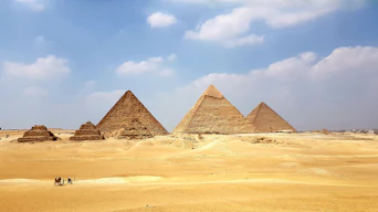brown pyramid under blue sky during daytime