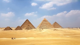 brown pyramid under blue sky during daytime