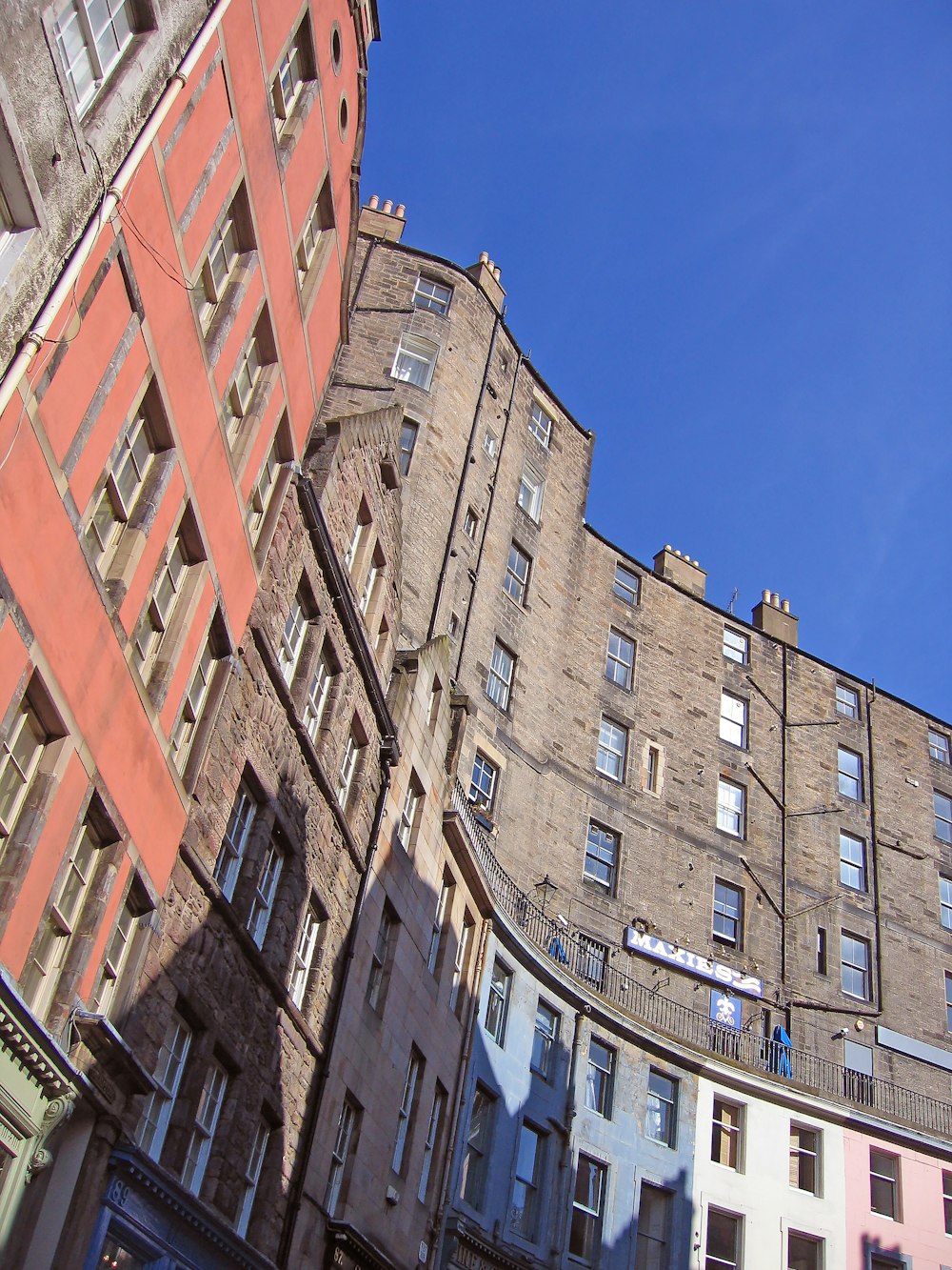 brown concrete building under blue sky during daytime