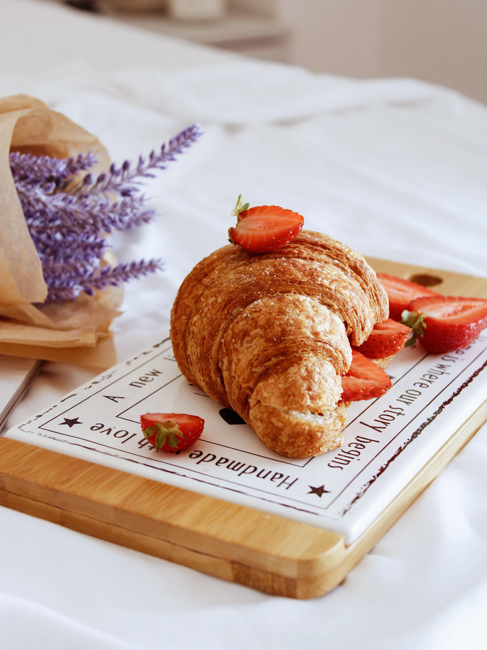 Pain au chocolat pastries on a white wooden tray