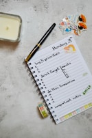 A simple plank of healthy daily essentials: journal, fresh fruit, and a pair of walking shoes.