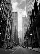 grayscale photo of city buildings
