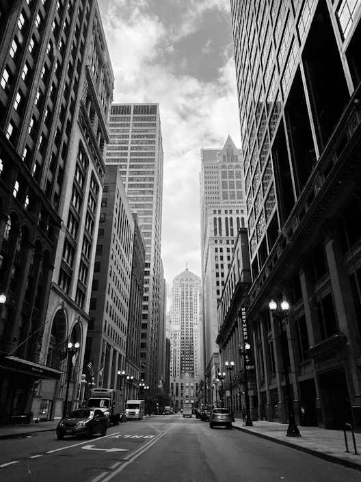 grayscale photo of city buildings