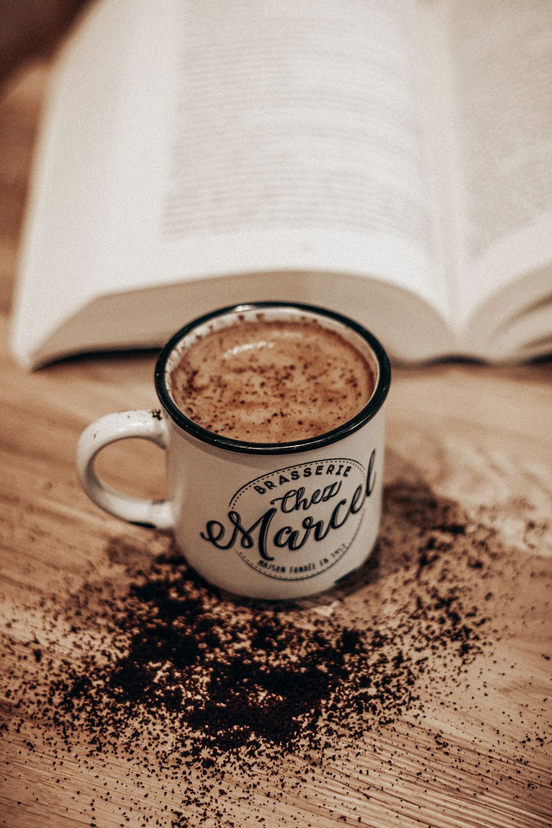 white ceramic mug on brown and black coffee beans