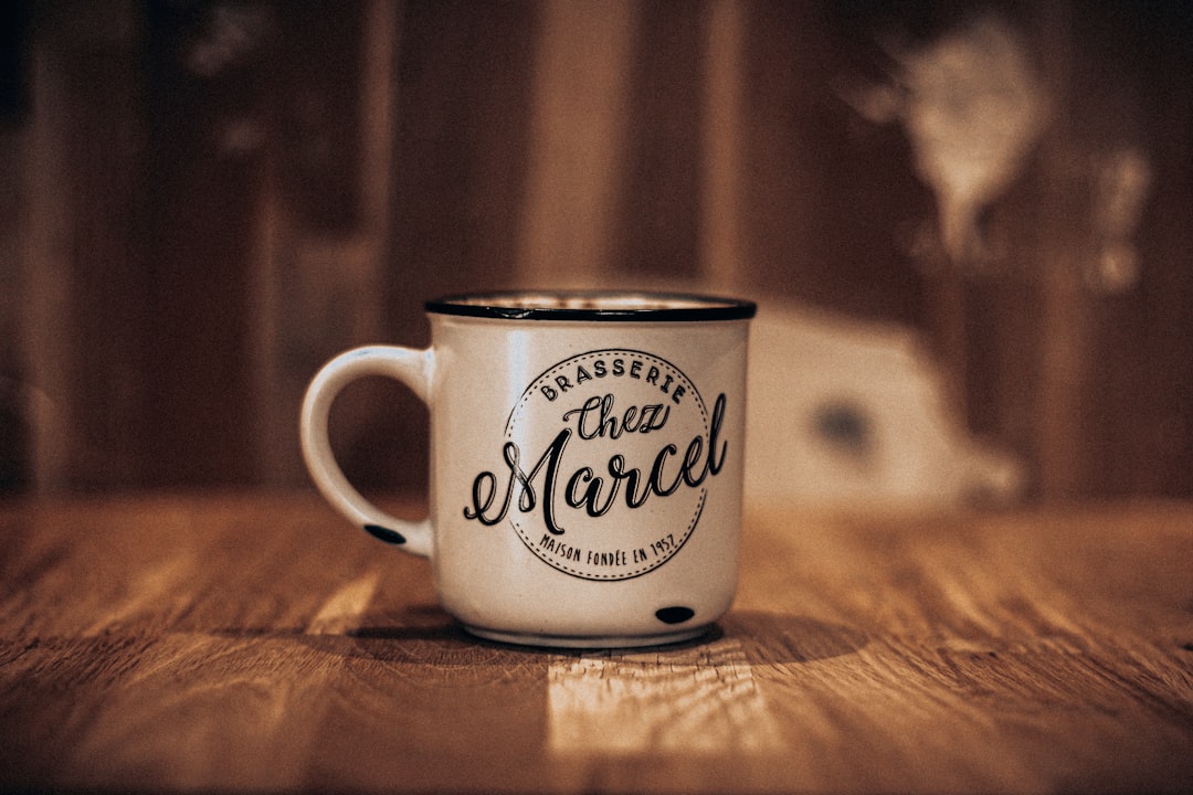 white and black ceramic mug