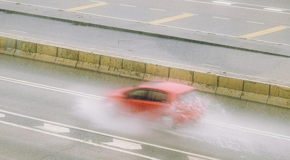 red and white car on road during daytime