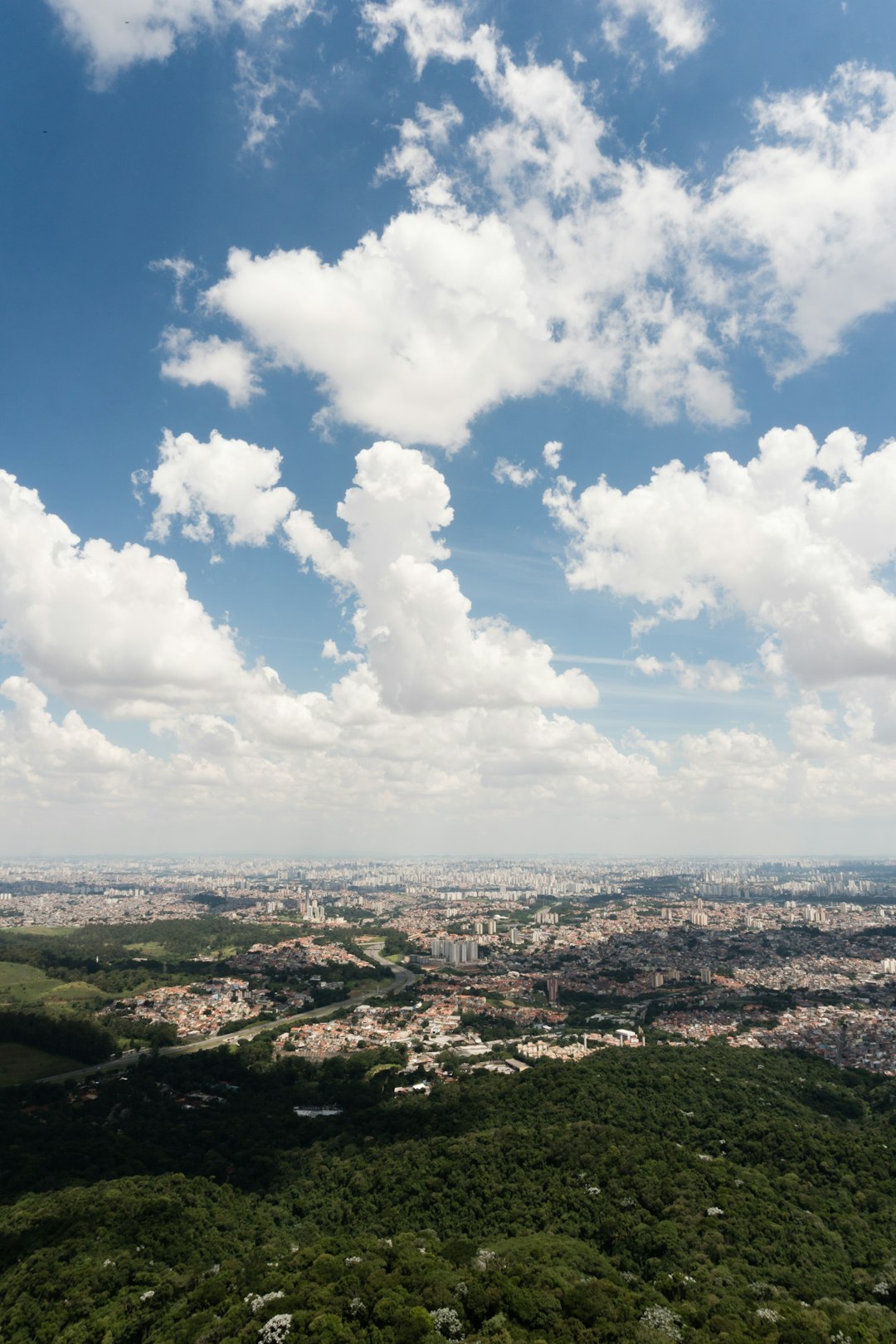 aerial view of city under cloudy sky during daytime