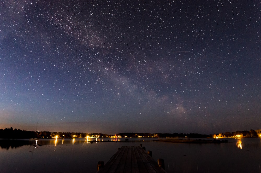 body of water under starry night