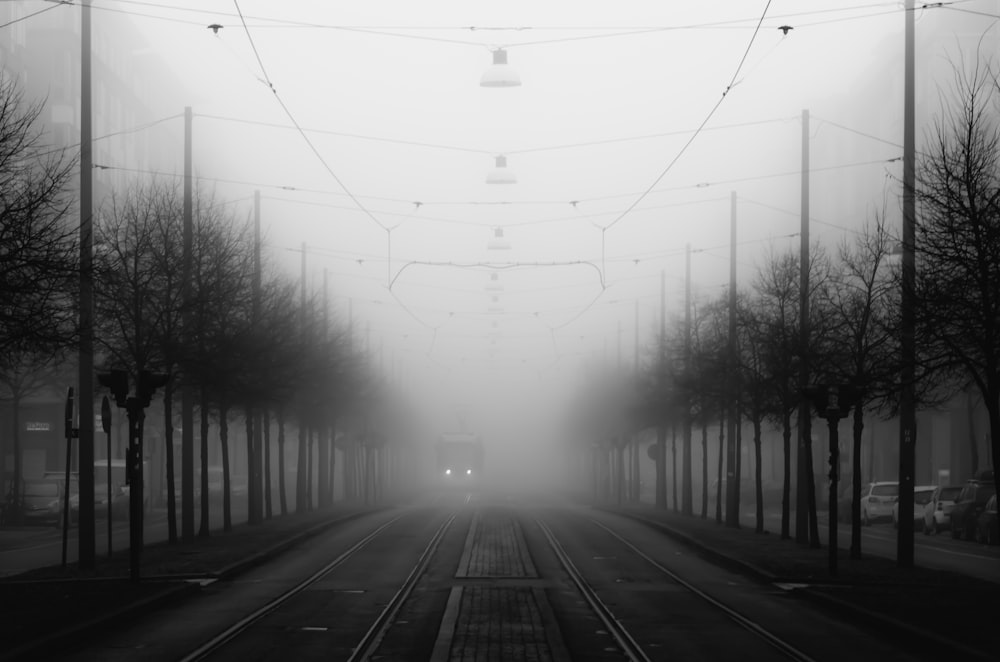 grayscale photo of train rail