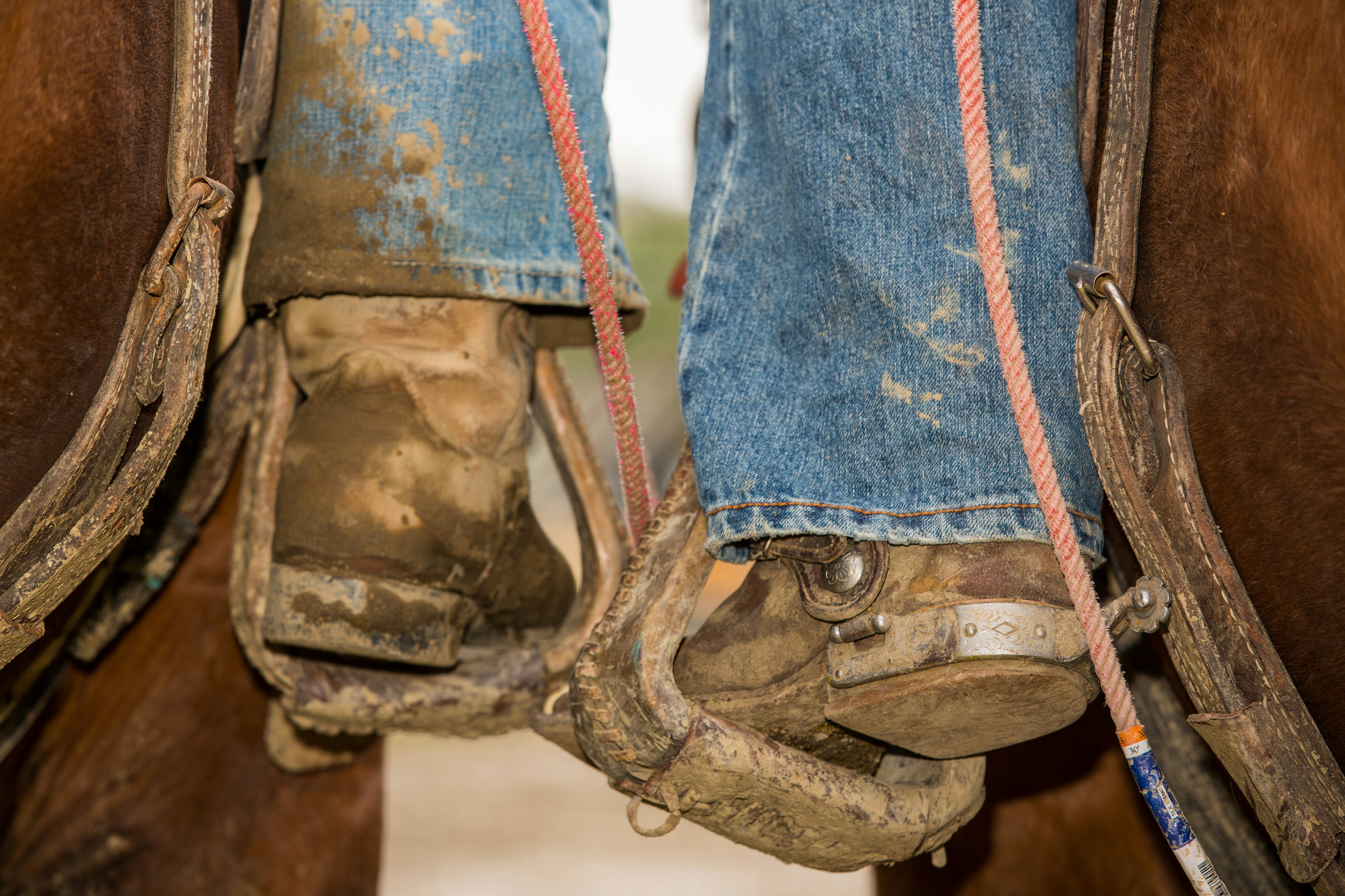 person in blue denim jeans and brown hiking boots