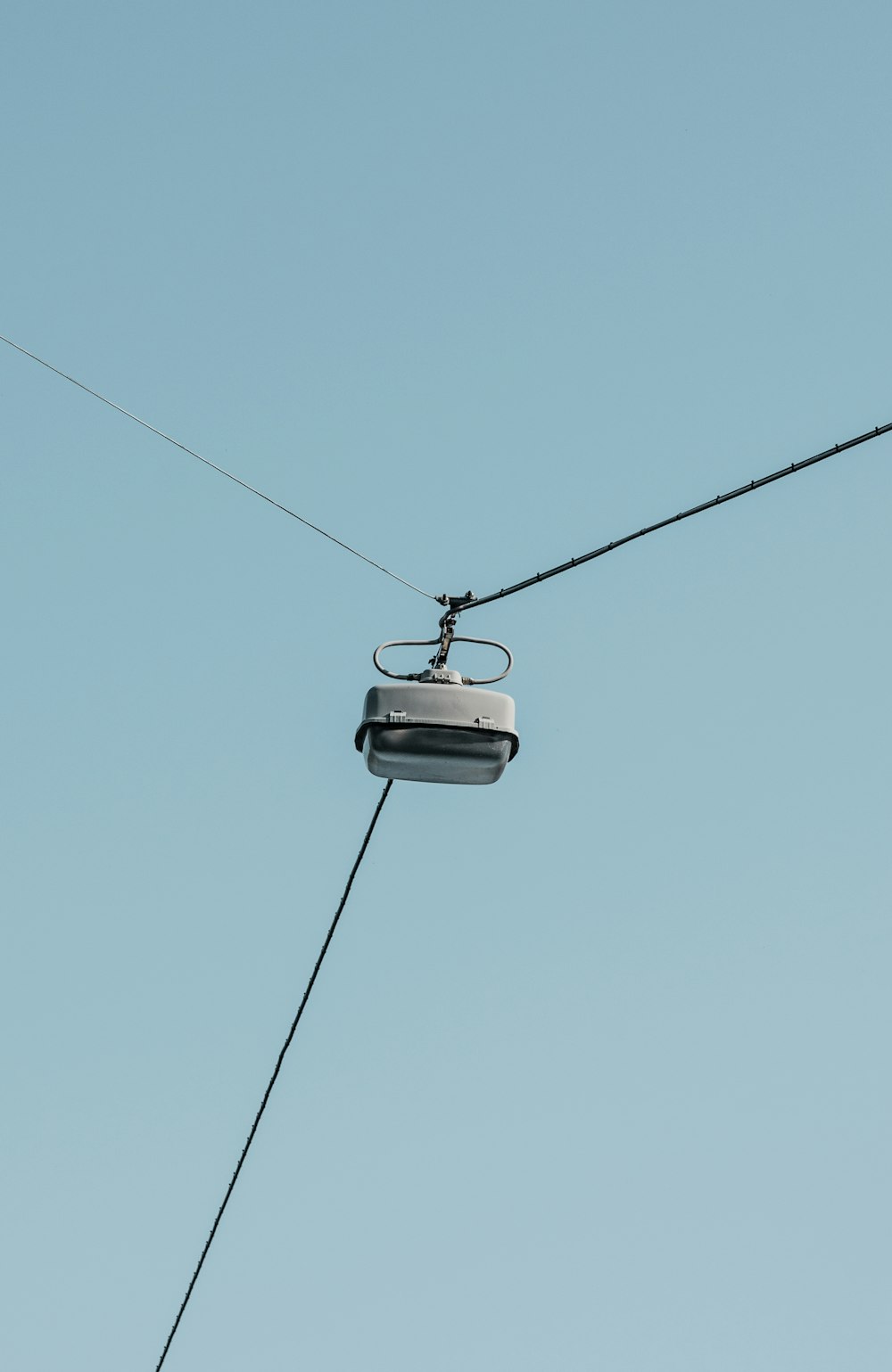 black cable car under blue sky during daytime