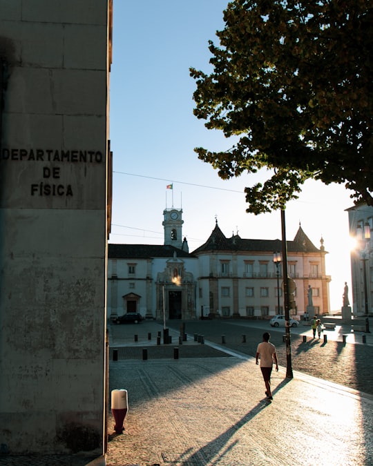 people walking on sidewalk near building during daytime in Pátio das Escolas Portugal