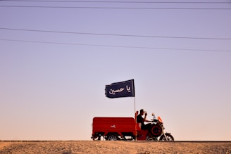 A user operating the solar tricycle in a sunny environment.