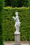 white concrete statue of a man