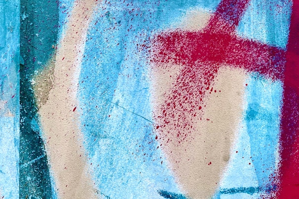 A vibrant contemporary painting by Carolina Migueles featuring bold red and blue accents on a white background.