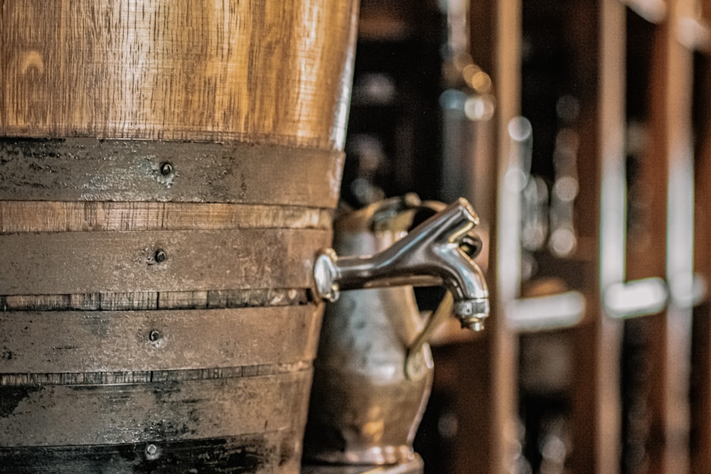 brown wooden barrel with stainless steel faucet