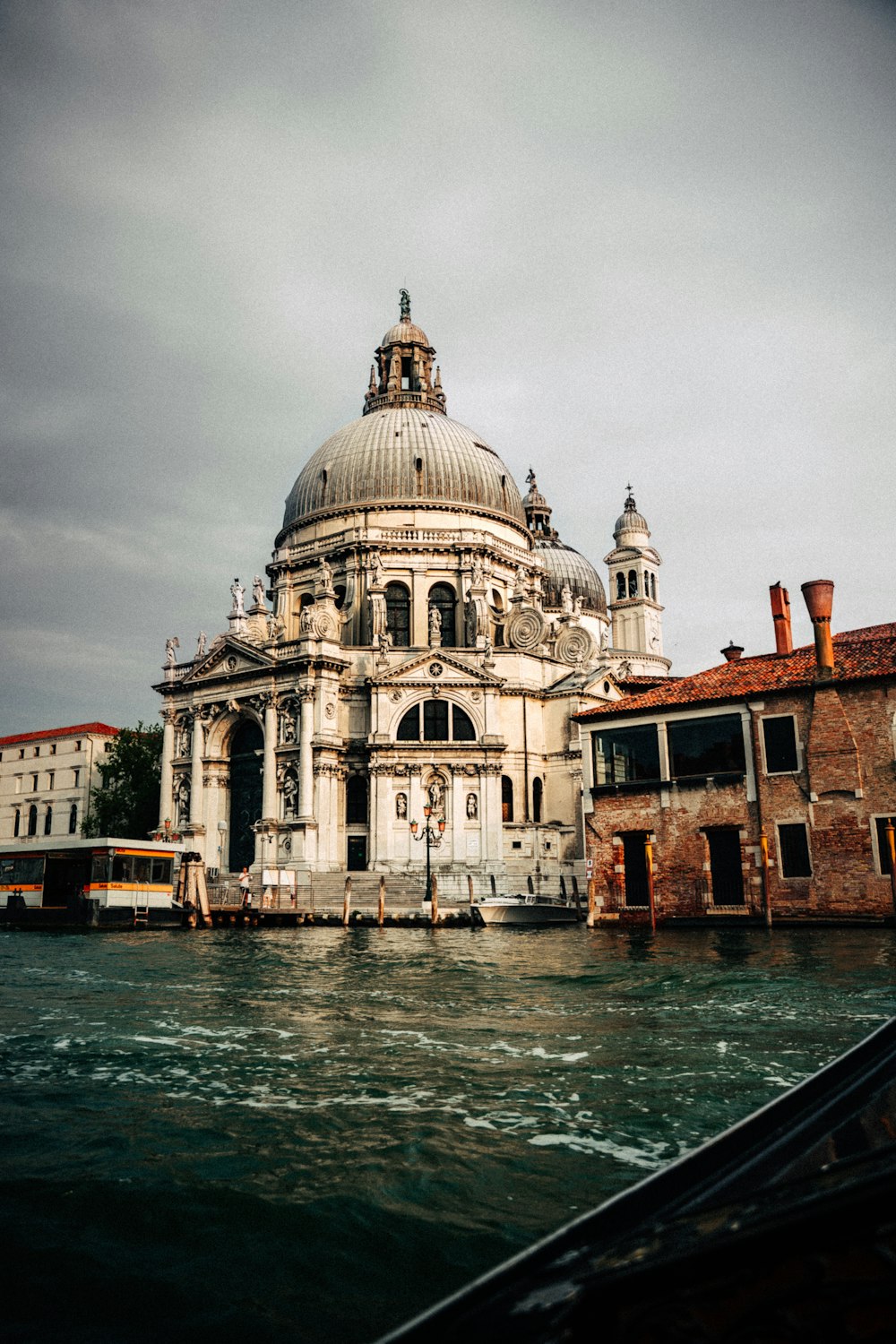 white and brown dome building near body of water during daytime