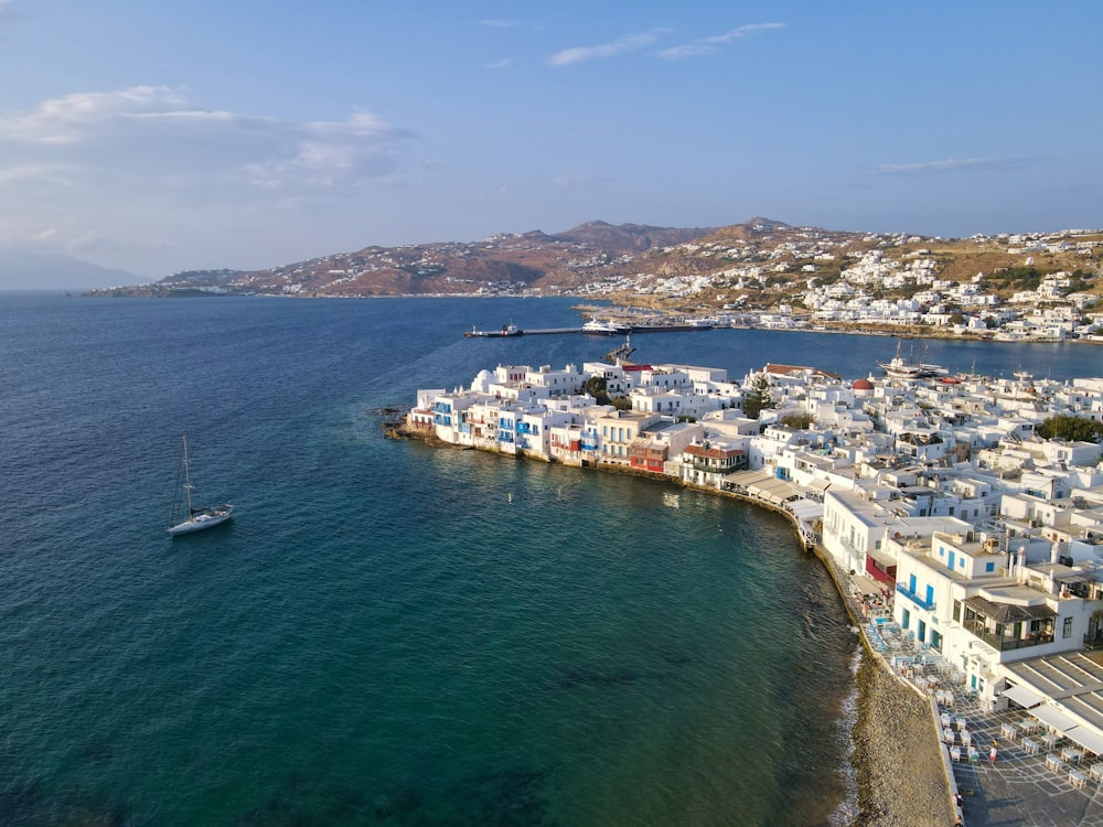 white and blue boat on sea during daytime