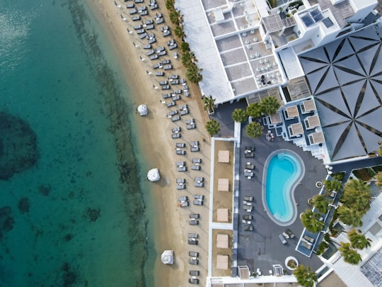 aerial view of city buildings and body of water during daytime in Mýkonos Greece