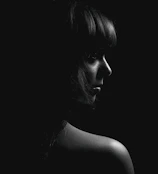 A high-resolution minimalist black and white portrait with soft natural lighting