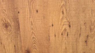 Close-up of a handcrafted wooden photo frame with visible natural grain and subtle imperfections.