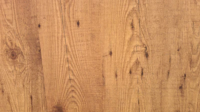 Close-up of a handcrafted wooden photo frame with visible natural grain and subtle imperfections.