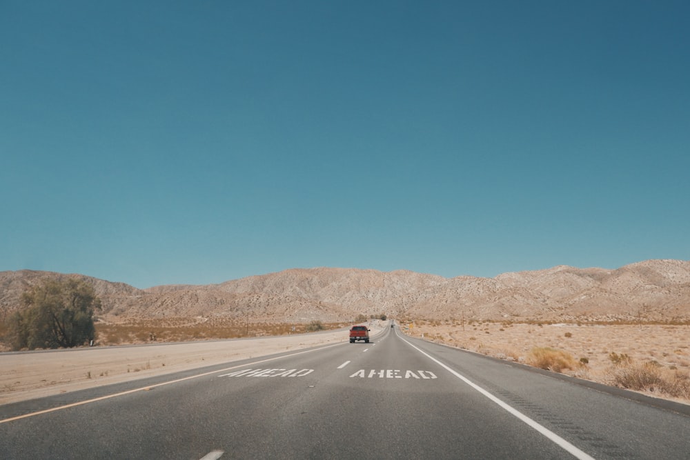 black car on road during daytime