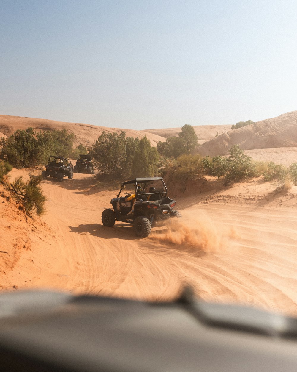 black jeep wrangler on brown dirt road during daytime