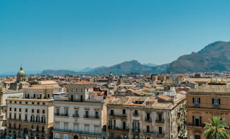 white and brown concrete buildings under blue sky during daytime