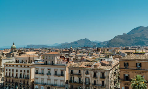 white and brown concrete buildings under blue sky during daytime