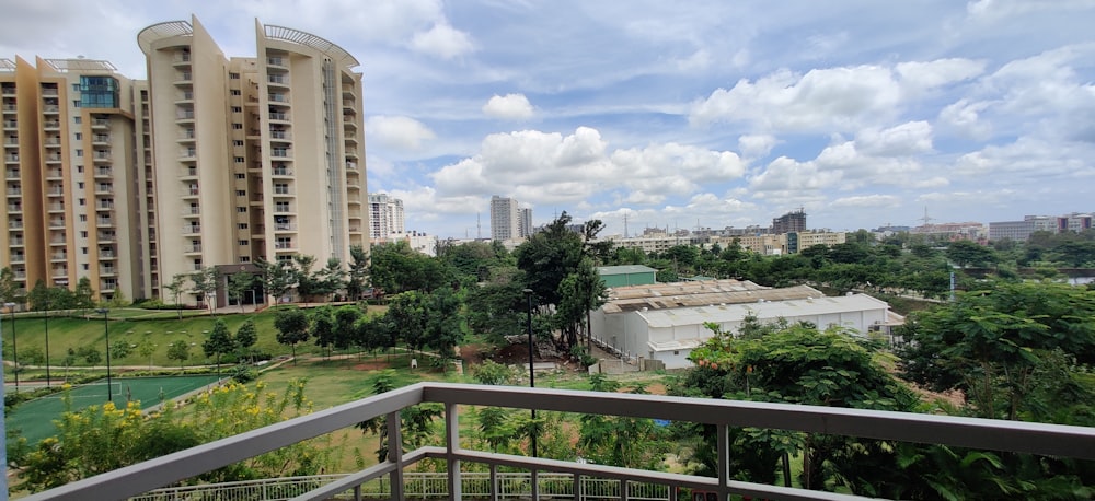 white concrete building near green trees during daytime