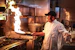 man in white chef uniform cooking