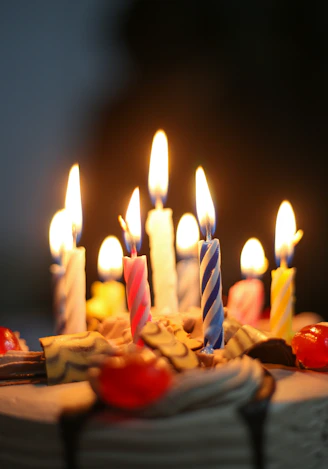 lighted candles on brown wooden table