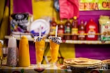clear drinking glass with yellow liquid