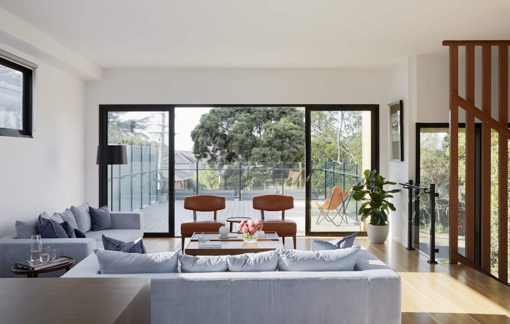 gray sectional couch near green potted plant