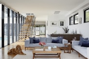 brown wooden coffee table near gray couch