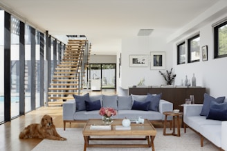 brown wooden coffee table near gray couch