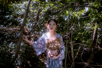 Sunlit indigenous healer preparing botanical remedies surrounded by lush forest greenery.