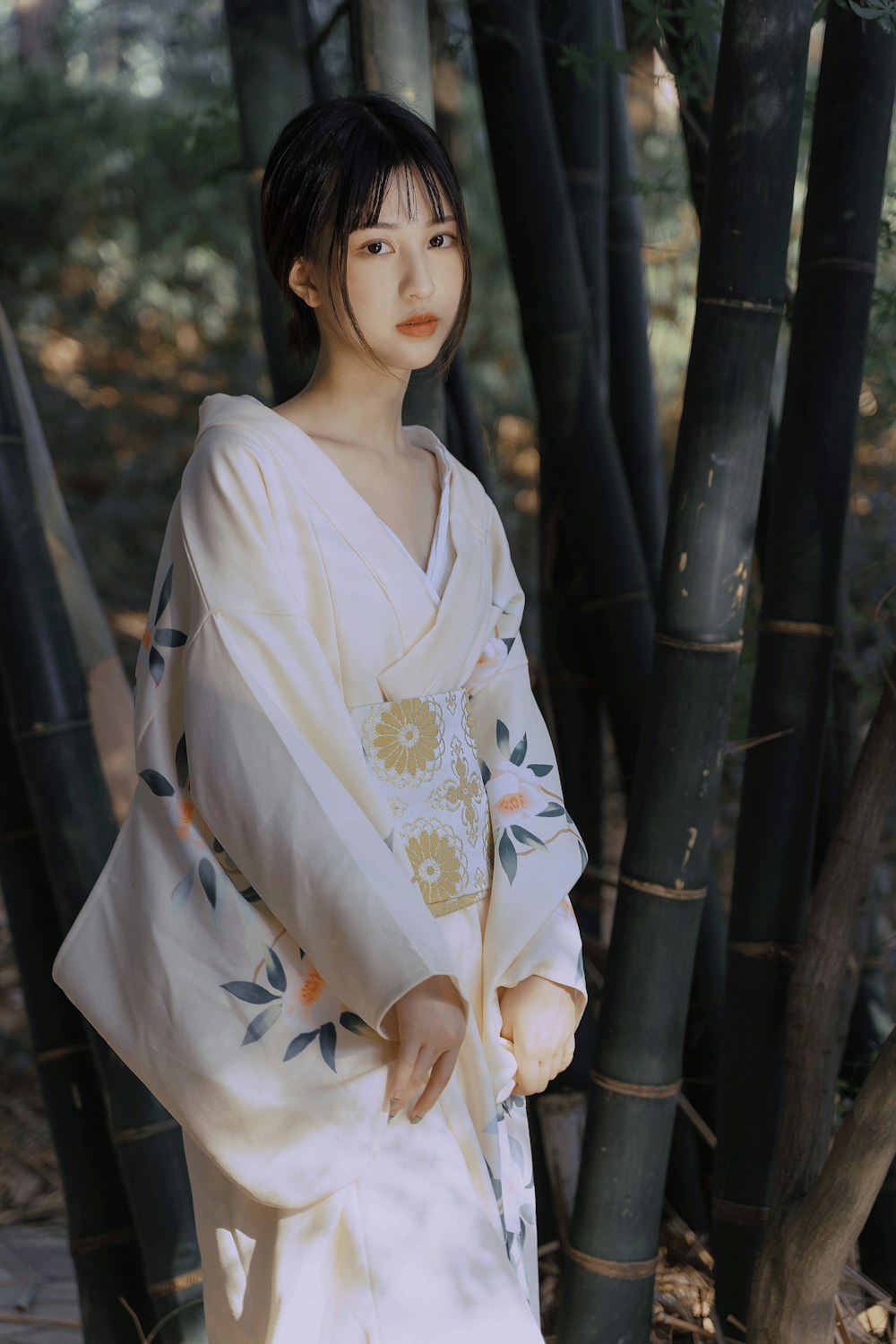woman in white and yellow floral kimono