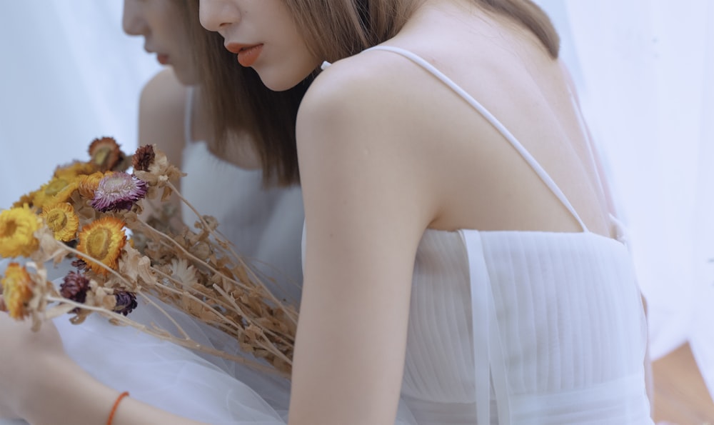 woman in white sleeveless dress