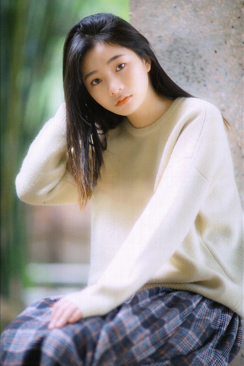 woman in white long sleeve shirt and blue denim jeans