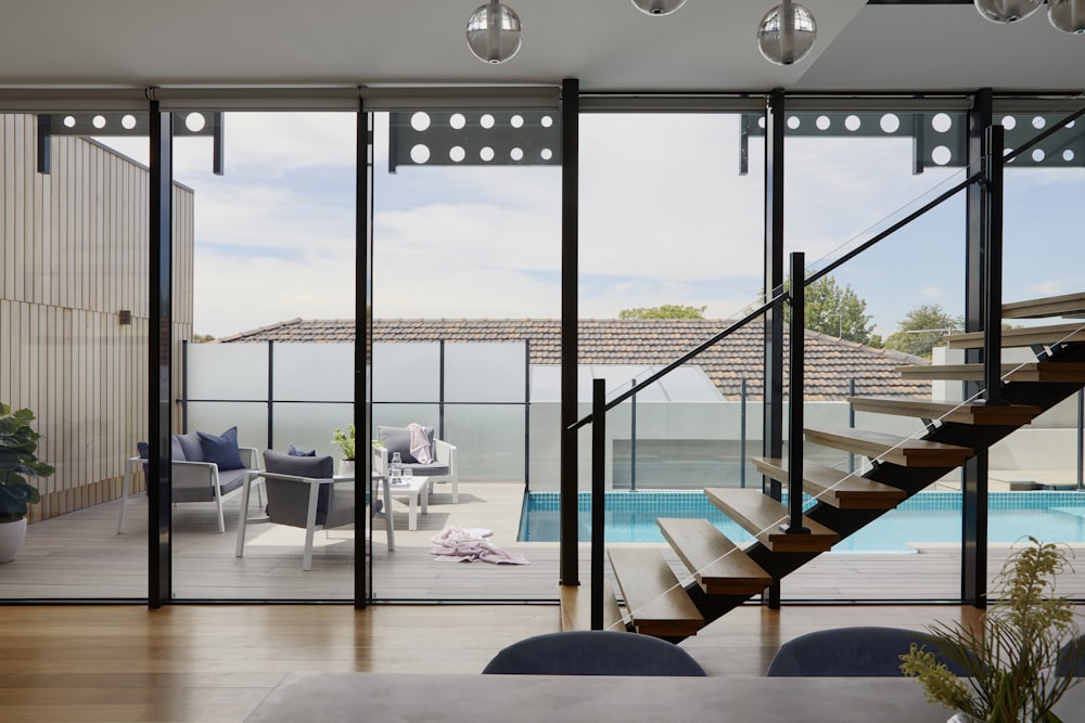 brown wooden table and chairs on white floor tiles