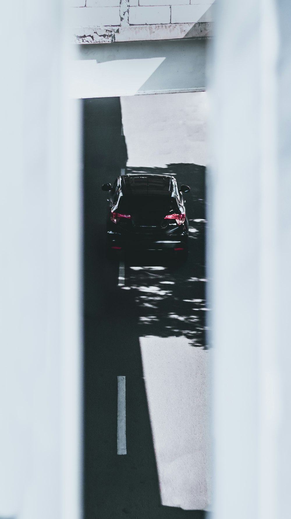 black car on road during daytime