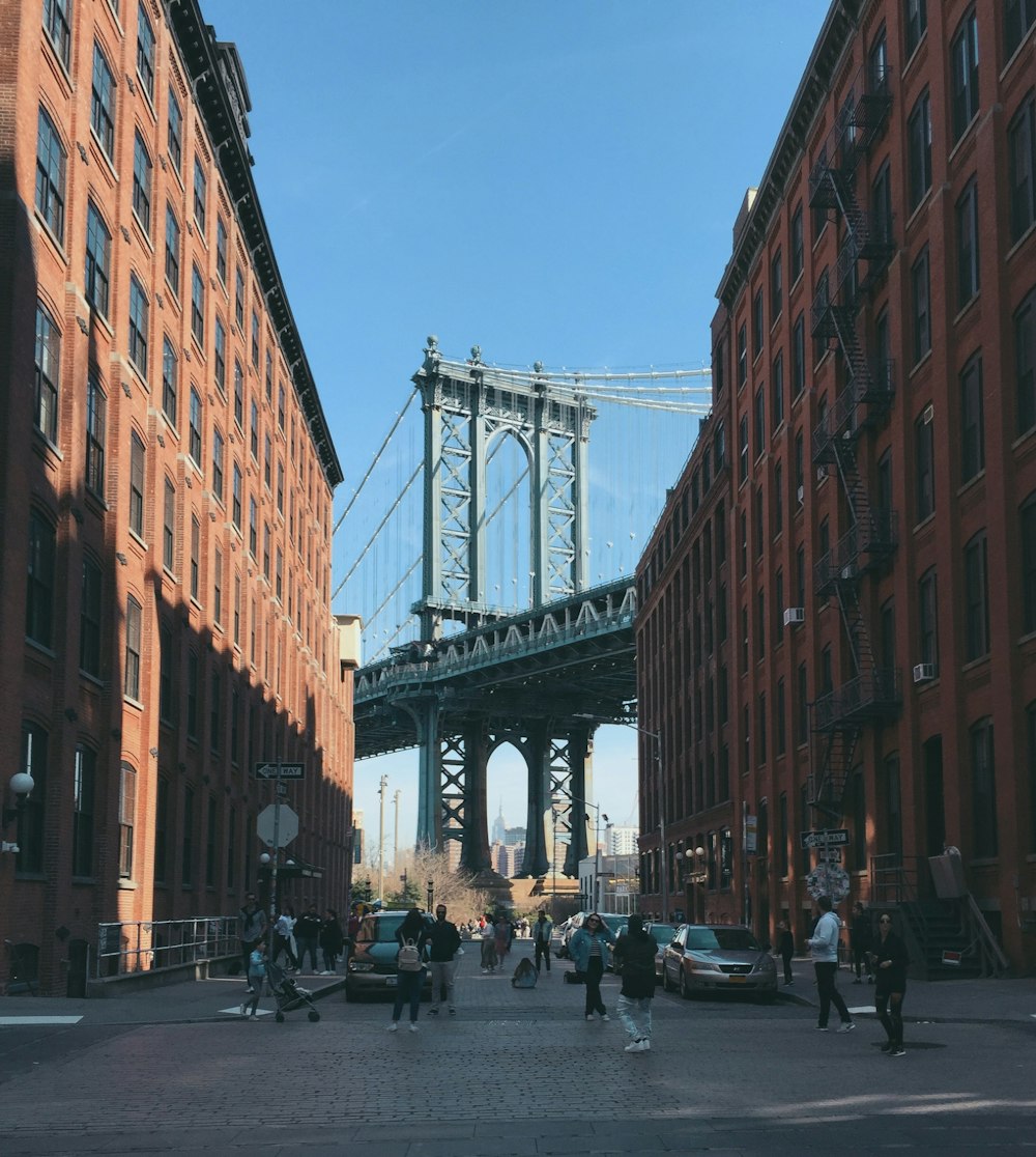 people walking on street near brown concrete building during daytime