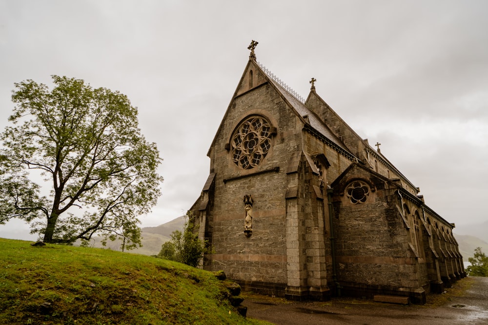 gray concrete church on green grass field