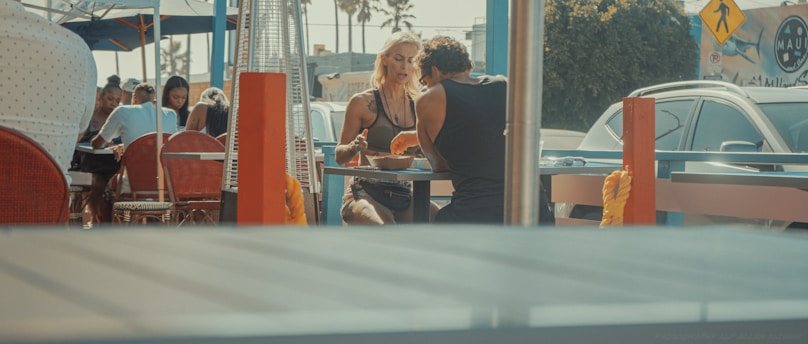 woman in black tank top sitting on chair