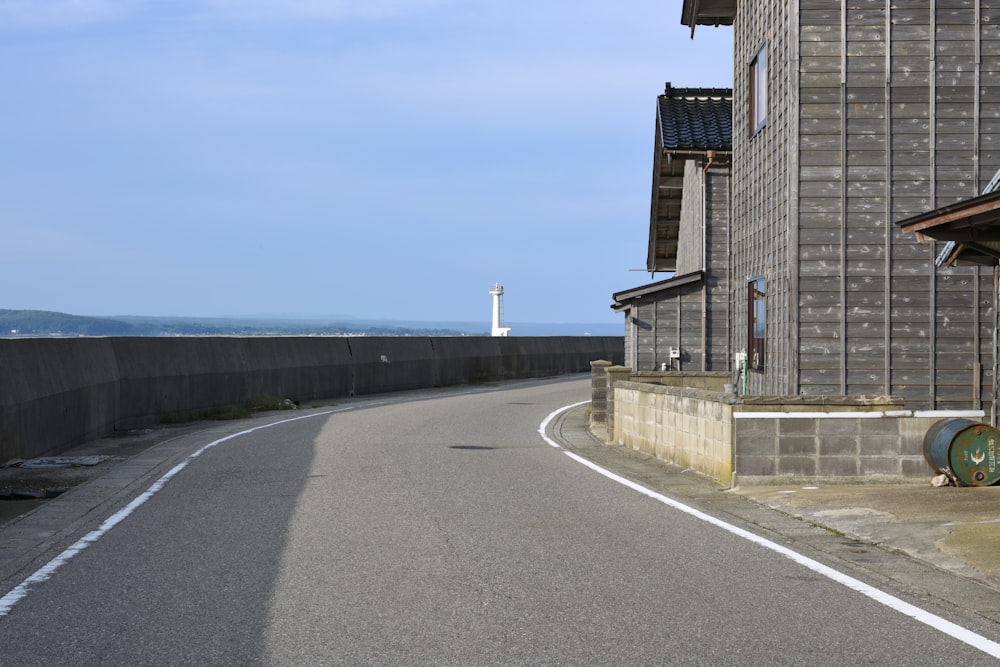 brown brick building beside gray concrete road