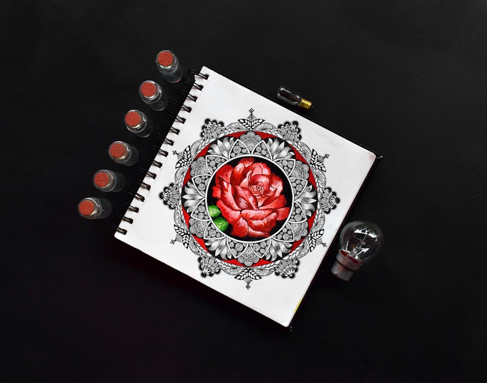 red rose on white paper